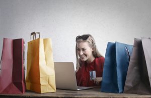 happy woman shopping online, maybe using AfterPay