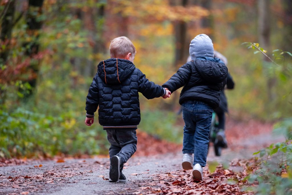 Children running together, playing outside