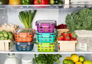 an open fridge showing well organised and healthy food