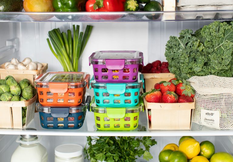 an open fridge showing well organised and healthy food